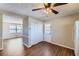 Bright dining area featuring wood floors, ceiling fan, and a door to the backyard at 12142 Panhandle Rd, Hampton, GA 30228