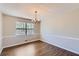 The dining room offers wood flooring and a window with views of the backyard at 12142 Panhandle Rd, Hampton, GA 30228