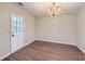 Dining room with modern lighting fixture and door to patio at 12142 Panhandle Rd, Hampton, GA 30228