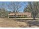 Ranch style home with a long porch and mature trees at 12142 Panhandle Rd, Hampton, GA 30228