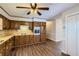 Traditional kitchen with wood cabinets, laminate counters and modern appliances at 12142 Panhandle Rd, Hampton, GA 30228