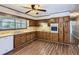 Traditional kitchen with wood cabinets, laminate counters and modern appliances at 12142 Panhandle Rd, Hampton, GA 30228