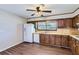 Traditional kitchen with wood cabinets, laminate counters and white appliances at 12142 Panhandle Rd, Hampton, GA 30228