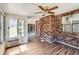 Bright sunroom with brick walls and fan at 12142 Panhandle Rd, Hampton, GA 30228