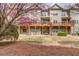 Multi-story townhomes feature walkout basements and private wooden decks at 2275 W Village Se Ln, Smyrna, GA 30080