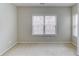 Bedroom featuring neutral paint, plush carpet, and natural light from the window at 2275 W Village Se Ln, Smyrna, GA 30080