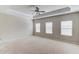 Spacious bedroom featuring tray ceiling, neutral walls, carpet flooring, and many windows letting in natural light at 2275 W Village Se Ln, Smyrna, GA 30080