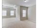 Bright bedroom featuring carpet flooring, ceiling fan, and many windows letting in natural light at 2275 W Village Se Ln, Smyrna, GA 30080