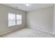 Bedroom featuring neutral paint, plush carpet, and natural light from the window at 2275 W Village Se Ln, Smyrna, GA 30080