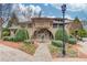 The clubhouse with stone accents is surrounded by landscaping at 2275 W Village Se Ln, Smyrna, GA 30080