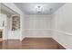 Elegant dining room with hardwood floors, built-in shelving, and ample space at 2275 W Village Se Ln, Smyrna, GA 30080