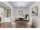 Bright dining room featuring hardwood floors, modern lighting, and stylish decor at 2275 W Village Se Ln, Smyrna, GA 30080