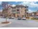 Modern brick building with balconies and parking in front on a sunny day at 2275 W Village Se Ln, Smyrna, GA 30080
