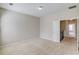 Open living room featuring carpet flooring, neutral walls, and lots of natural light at 2275 W Village Se Ln, Smyrna, GA 30080