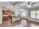 Spacious living space with a kitchen, hardwood floors, and modern ceiling fan at 2275 W Village Se Ln, Smyrna, GA 30080