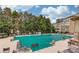 Community pool covered with a green tarp and surrounded by lounge chairs at 2275 W Village Se Ln, Smyrna, GA 30080