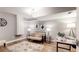 A cozy basement featuring a seating area, stylish decor, and a functional workspace with a laptop and modern lighting at 1580 Commerce Dr # A8, Decatur, GA 30030