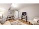 Inviting basement space with a comfortable seating arrangement, a functional desk setup, and a convenient entertainment area at 1580 Commerce Dr # A8, Decatur, GA 30030