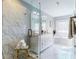 Bright bathroom with glass shower, soaking tub, double vanity, and modern lighting at 1580 Commerce Dr # A8, Decatur, GA 30030