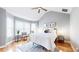 Bedroom features a vaulted ceiling, bay window, hardwood floors, and ceiling fan at 1580 Commerce Dr # A8, Decatur, GA 30030
