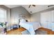 Bedroom features hardwood floors, vaulted ceilings, and a ceiling fan at 1580 Commerce Dr # A8, Decatur, GA 30030