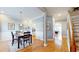Bright dining area with hardwood floors, chair rail detail and a view of the staircase at 1580 Commerce Dr # A8, Decatur, GA 30030