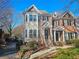 Charming townhome featuring a blend of brick and siding, complemented by mature landscaping at 1580 Commerce Dr # A8, Decatur, GA 30030