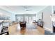 Open living room features hardwood floors, a modern ceiling fan and lots of natural light at 1580 Commerce Dr # A8, Decatur, GA 30030