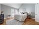 Bright main bedroom with vaulted ceilings, hardwood floors, and neutral decor offers a calming atmosphere at 1580 Commerce Dr # A8, Decatur, GA 30030