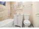 Updated bathroom featuring tiled shower and flooring, and white vanity at 1899 Lathrop Se St, Atlanta, GA 30315