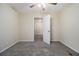 Comfortable carpeted bedroom with fresh paint and closet at 1899 Lathrop Se St, Atlanta, GA 30315