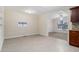 Open dining area featuring tile floors, large windows and access to kitchen at 1899 Lathrop Se St, Atlanta, GA 30315