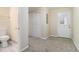 Hallway with carpeted floor and easy access to bathroom, storage and outside at 1899 Lathrop Se St, Atlanta, GA 30315