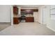Updated kitchen with granite countertops, stainless steel appliances, and dark wood cabinetry at 1899 Lathrop Se St, Atlanta, GA 30315