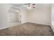 Inviting living room boasting neutral carpet, fresh paint, and a ceiling fan at 1899 Lathrop Se St, Atlanta, GA 30315