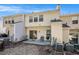 Rear exterior of townhomes features sliding doors, patios, and outdoor space at 2280 Whitestone Pl, Alpharetta, GA 30005