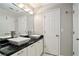 Bathroom features a black countertop with modern vessel sinks at 2280 Whitestone Pl, Alpharetta, GA 30005