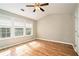 Bedroom features wood floors, ceiling fan, and large windows at 2280 Whitestone Pl, Alpharetta, GA 30005