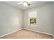 Carpeted bedroom features a ceiling fan and a window at 2280 Whitestone Pl, Alpharetta, GA 30005