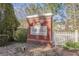 Stoneridge community entrance featuring a brick sign and manicured landscaping at 2280 Whitestone Pl, Alpharetta, GA 30005