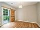 Bright dining room features a sliding barn door, modern light fixture, and ample space at 2280 Whitestone Pl, Alpharetta, GA 30005
