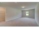 Large bedroom with neutral carpet, a window, a walk-in closet, and recessed lighting at 30 Homesite Cooper E Cv, Fayetteville, GA 30215