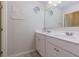Bright bathroom featuring double sinks and large mirror at 4675 Dandelion Way, Cumming, GA 30040