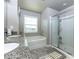 Bathroom featuring dual sinks, a bathtub, and a separate glass-enclosed shower at 4675 Dandelion Way, Cumming, GA 30040