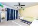 Well-lit bedroom featuring a modern ceiling fan and a decorative mirror at 4675 Dandelion Way, Cumming, GA 30040