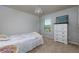 Comfortable bedroom featuring a decorative chandelier and large window at 4675 Dandelion Way, Cumming, GA 30040
