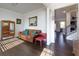 Open-concept living space with hardwood floors, stylish furniture, and abundant natural light at 4675 Dandelion Way, Cumming, GA 30040