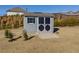 Charming shed featuring decorative doors and a ramp at 4675 Dandelion Way, Cumming, GA 30040