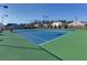 Community tennis court with net and lights for evening play at 4675 Dandelion Way, Cumming, GA 30040
