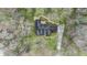 A beautiful aerial view of the roof of this home surrounded by trees at 90 Lakeside Dr, Hiram, GA 30141